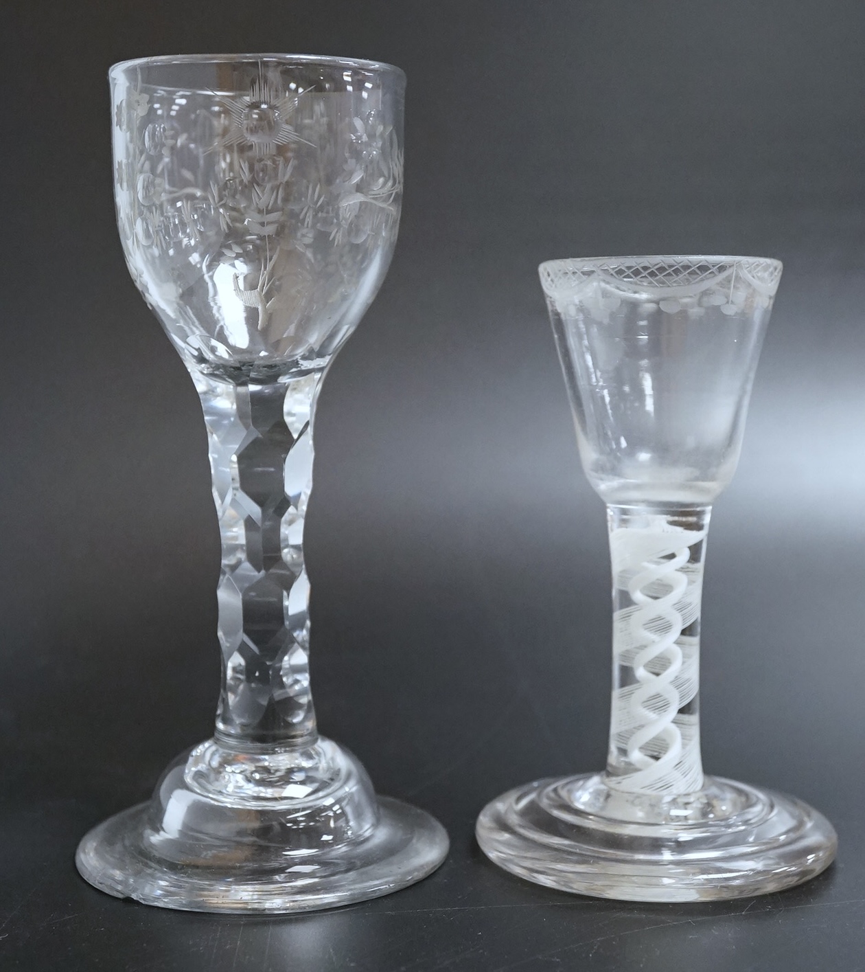 An opaque twist firing glass with terraced foot and a faceted wine glass with domed foot, c.1760, tallest 14cm